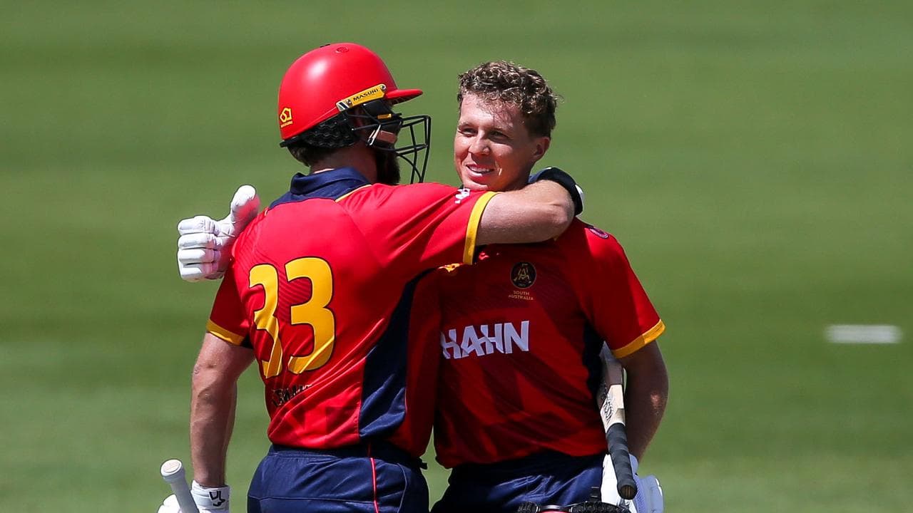 Jake Lehmann (left) congratulates Nathan McSweeney on his century.