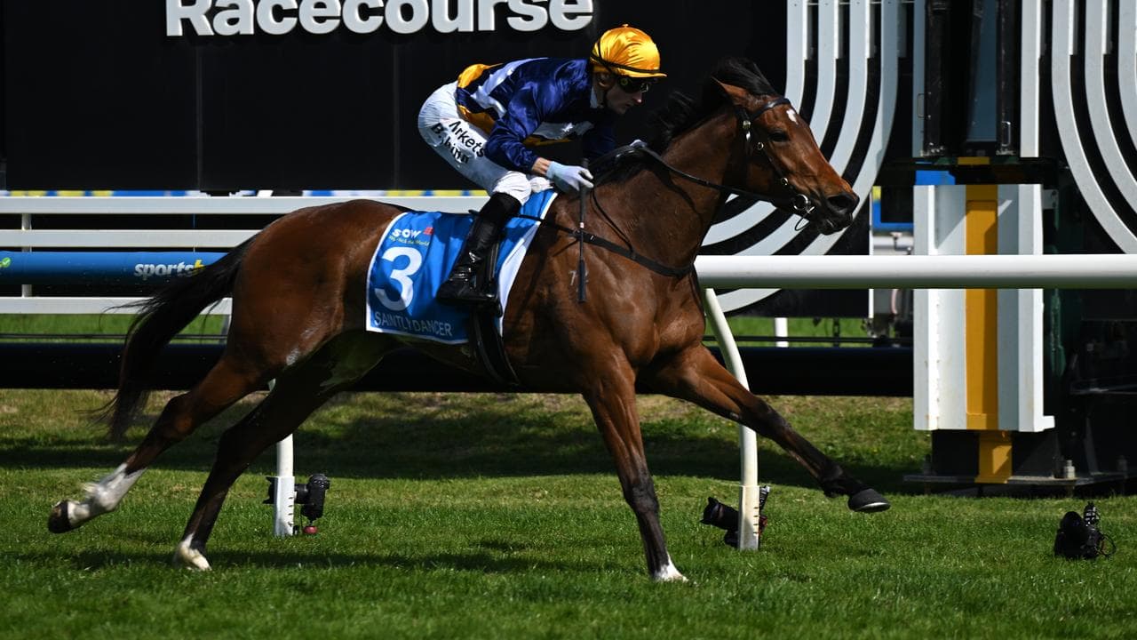Jockey Blake Shinn rides Saintly Dancer to victory
