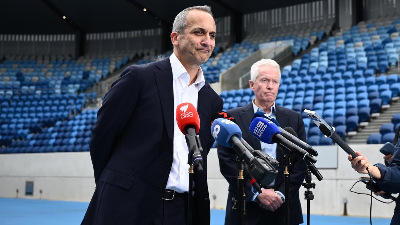 (L-R) Andrew Abdo and Craig Tiley.