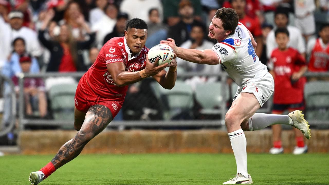 Tonga's Haumole Olakau’atu brushed past England's Ethan Havard