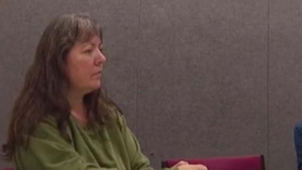 woman in police interview room