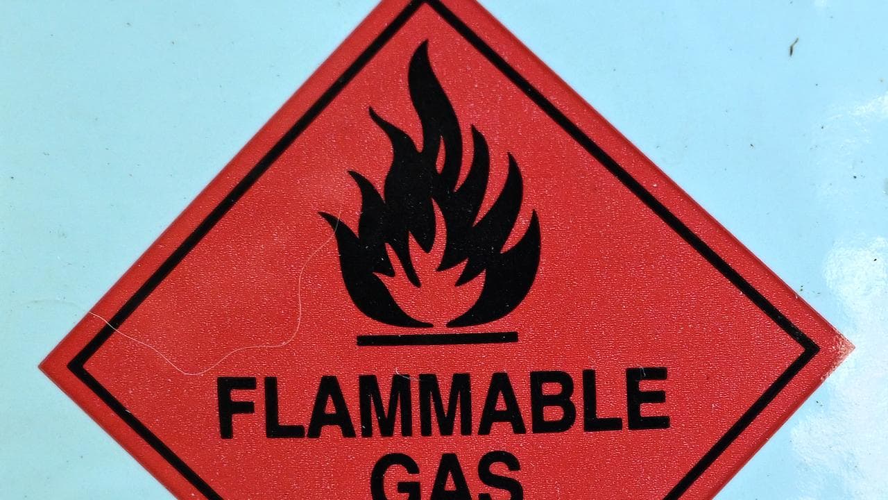 A warning sign on a barbecue LPG gas bottle