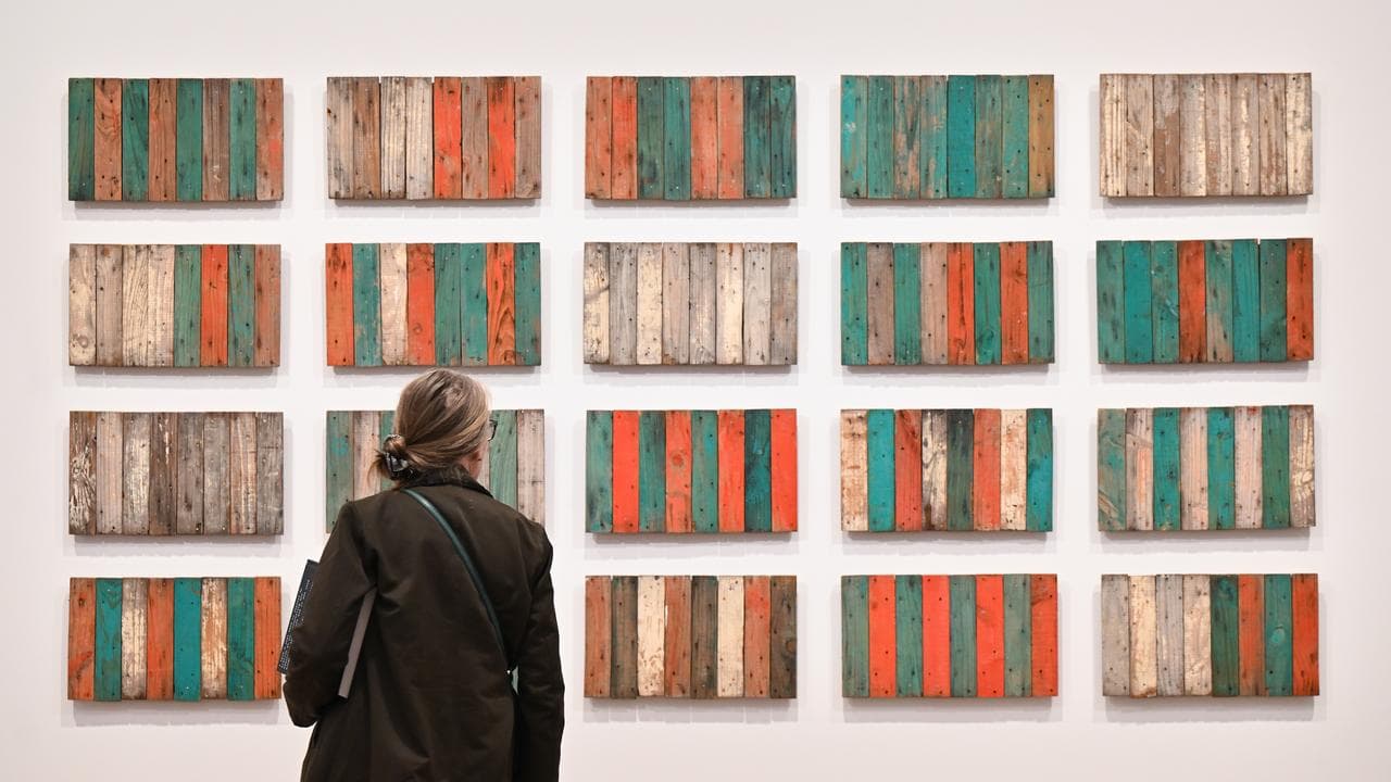 A person looks at an artwork