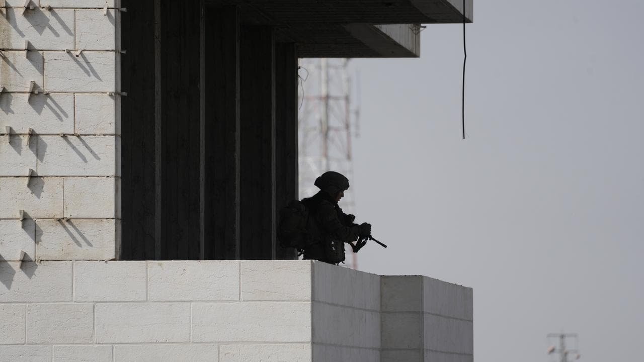 Israeli soldiers take up positions in Hebron