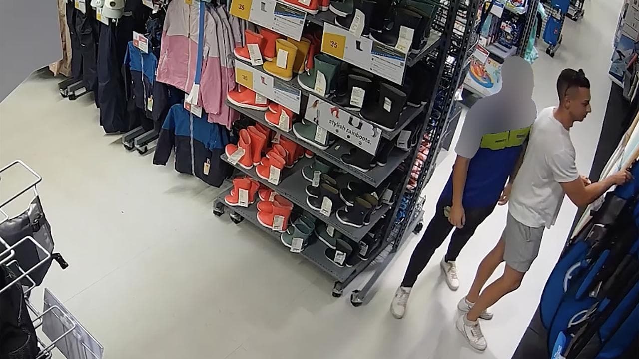 two men in sports shop