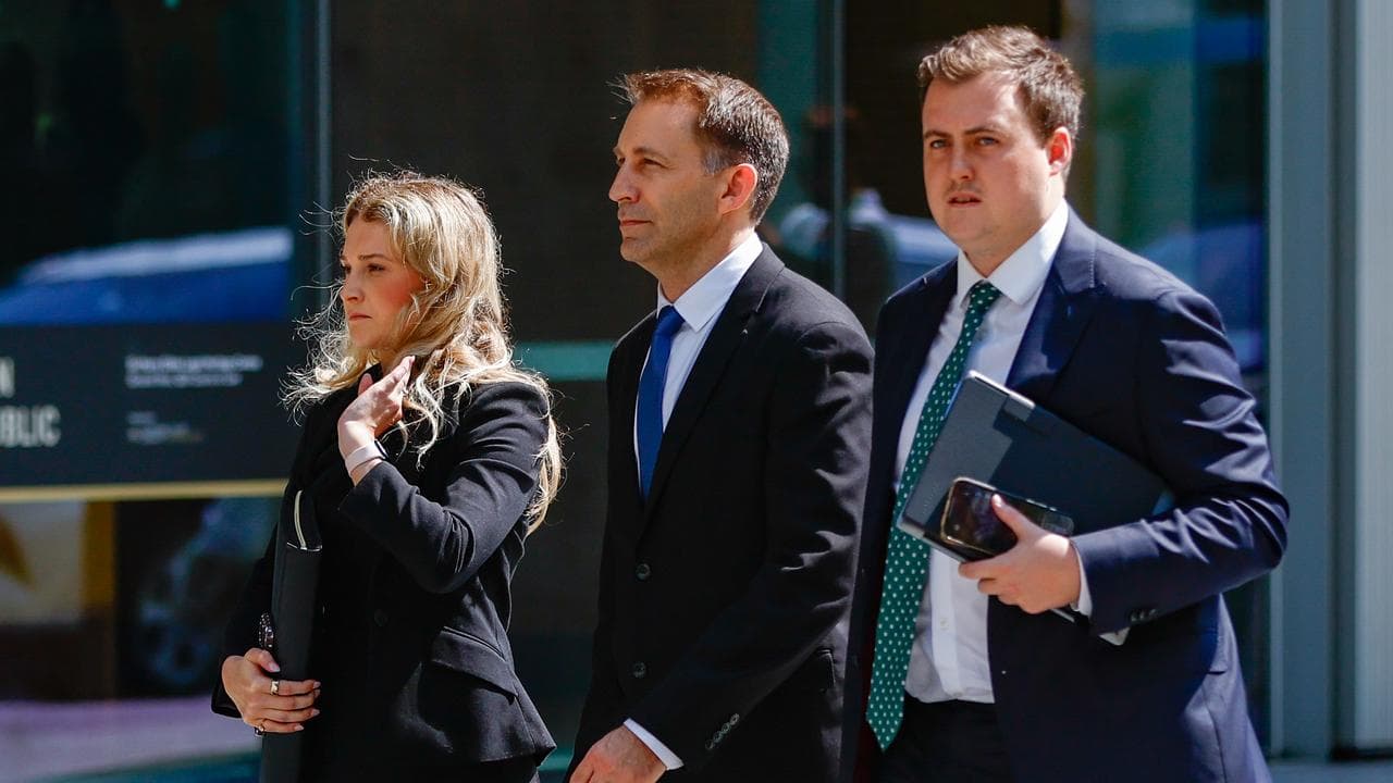 Crawford (centre) outside court