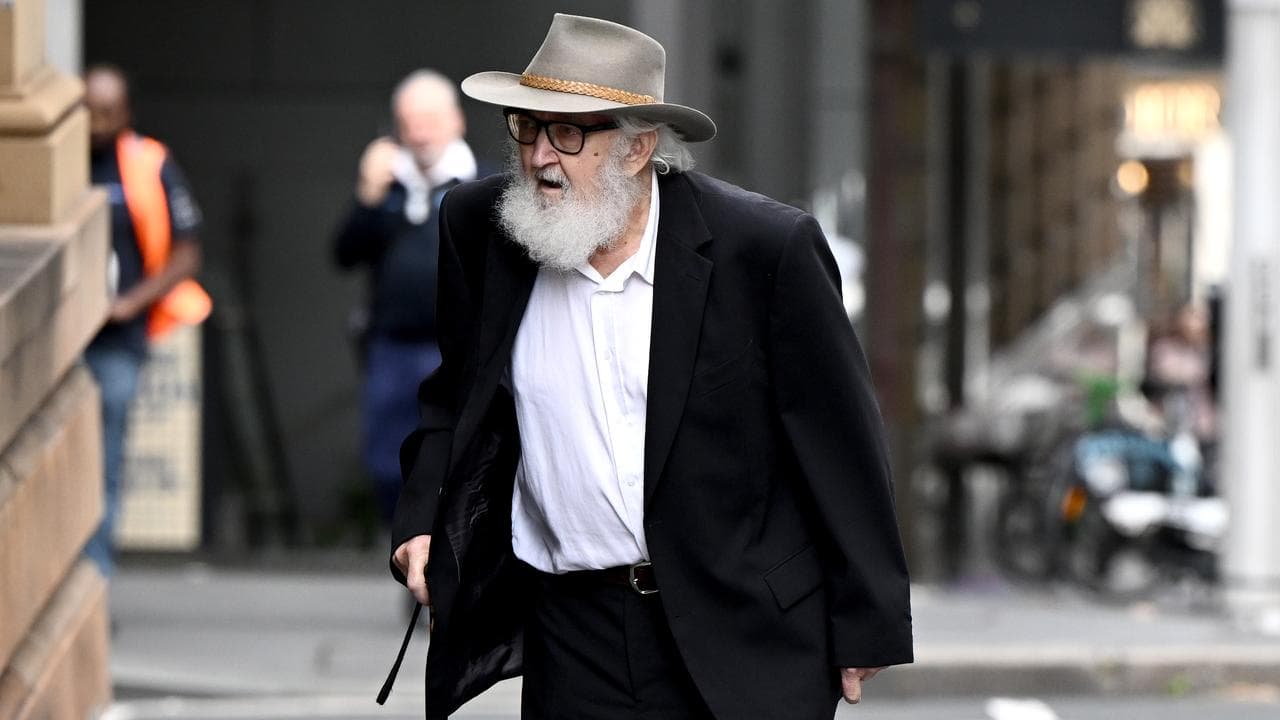 man with can in suit and hat