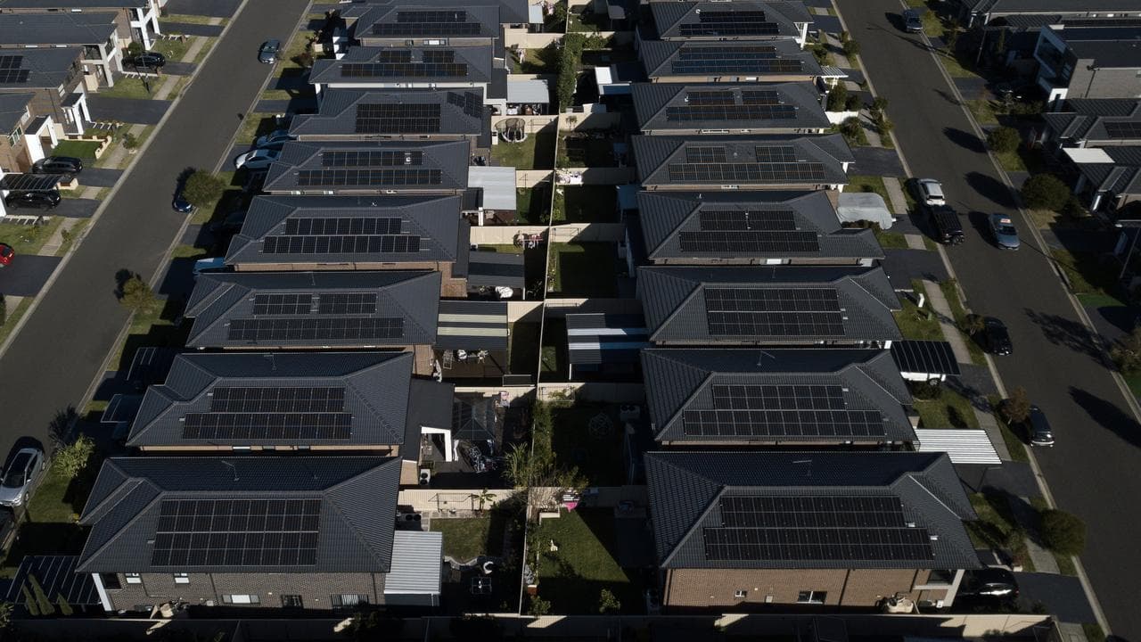 Houses are seen with rooftop solar panels (file image)