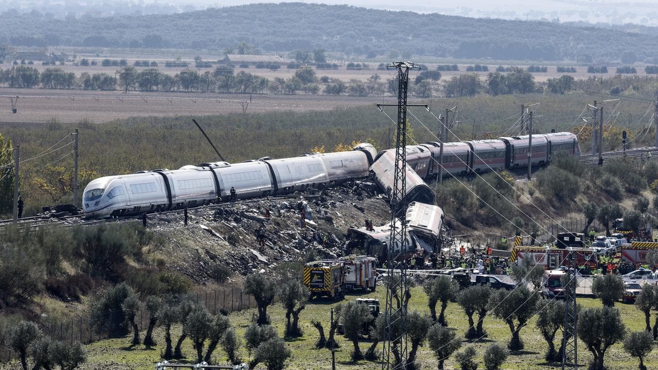 Emergency services work at the scene of a train crash in Urda, Spain