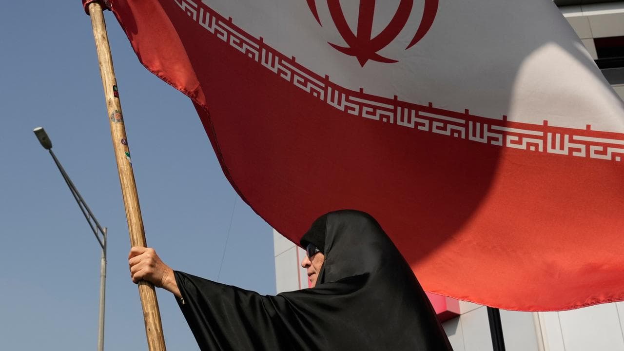 An Iranian flag as part of a pro-government rally in Tehran, Iran