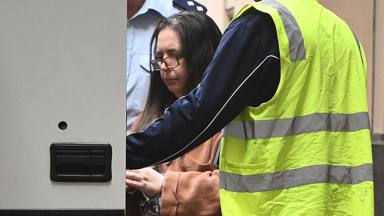 woman enters prison van