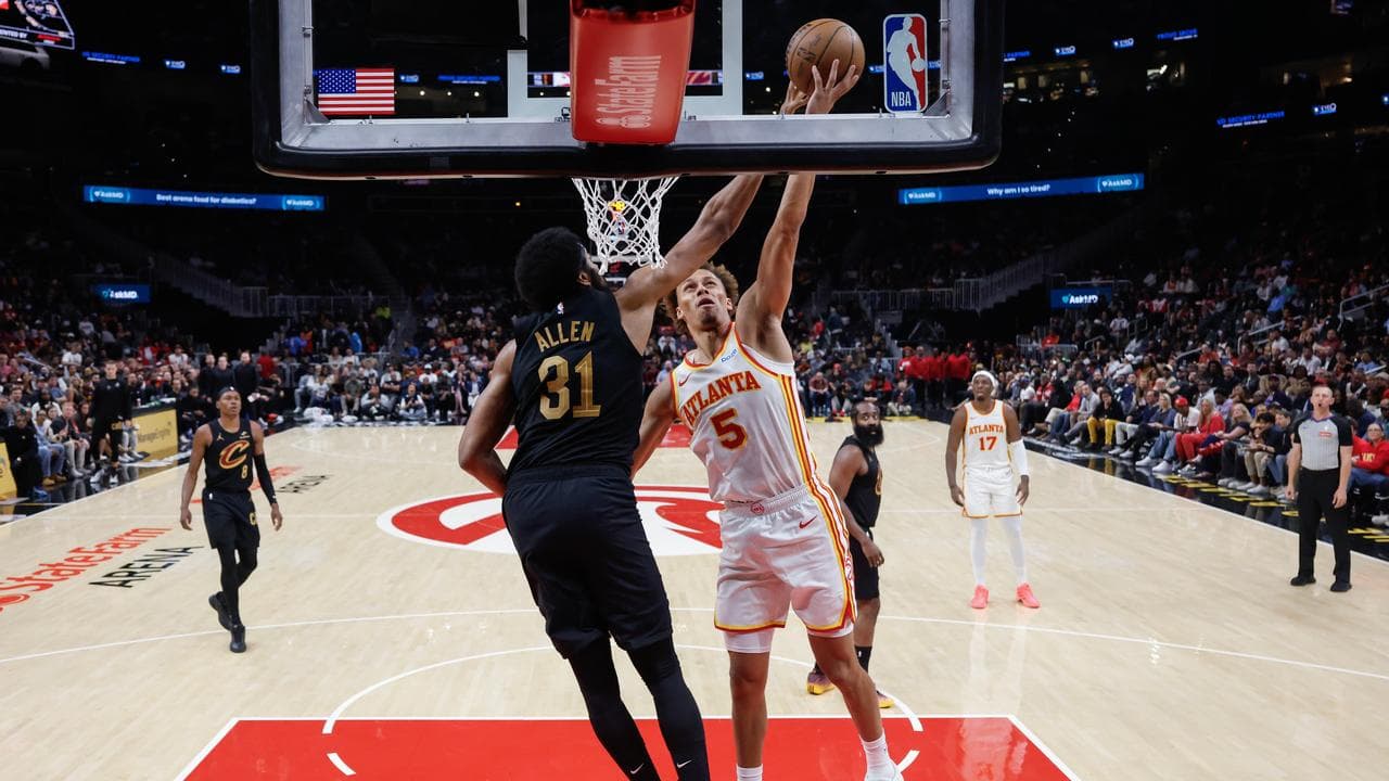 Atlanta's Dyson Daniels drives against the Cavaliers' Jarrett Allen.