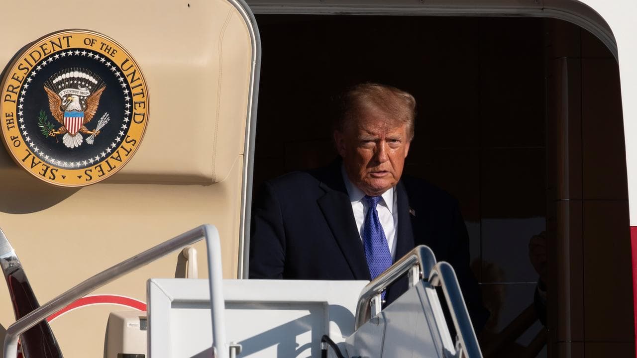 President Donald Trump exits Air Force One.