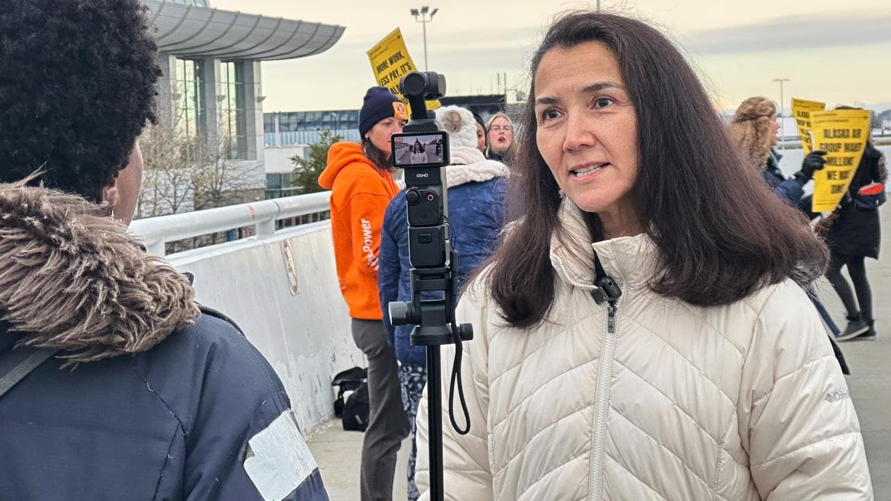 Democrat Senate nominee Mary Peltola speaks to a reporter in Alaska.
