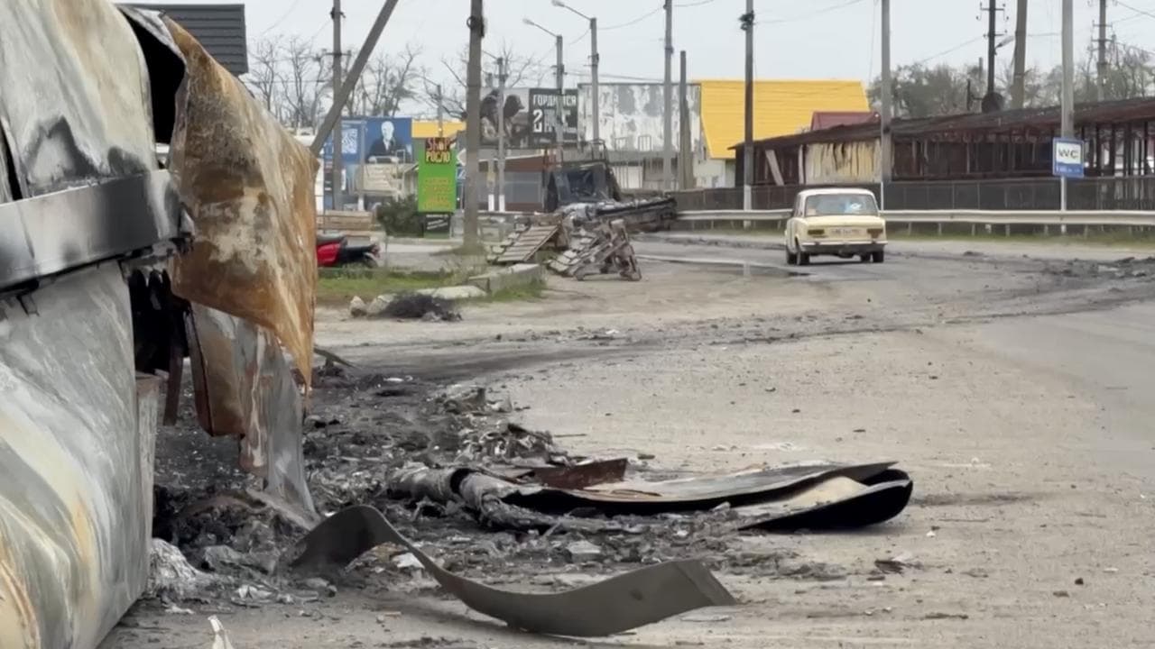 A local resident driving in the city of Oleshky in the Kherson region
