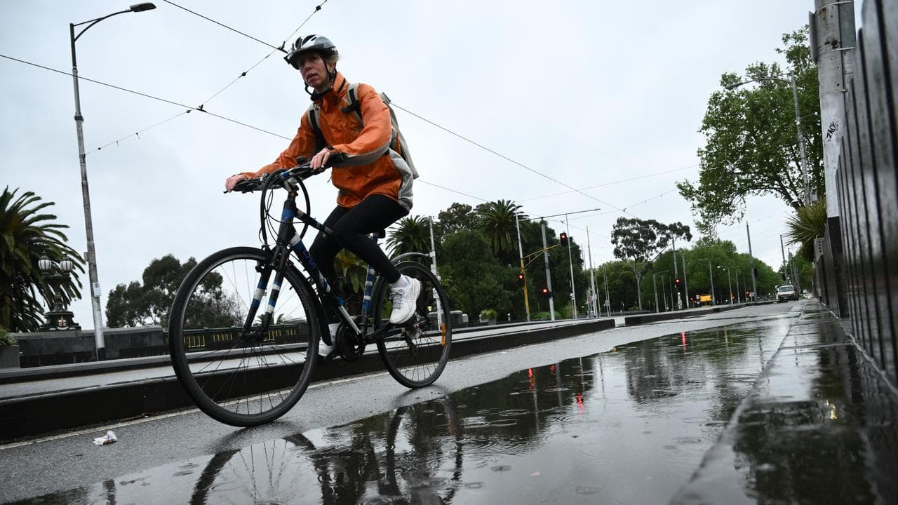 Commuters during wet weather in Melbourne,