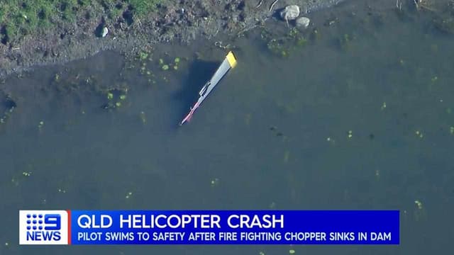 Firefighting pilot escapes as chopper fills with water