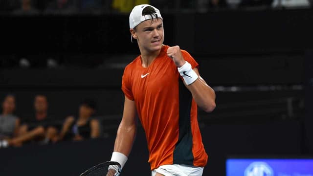 Top seed Rune overcomes Purcell in rainy Brisbane