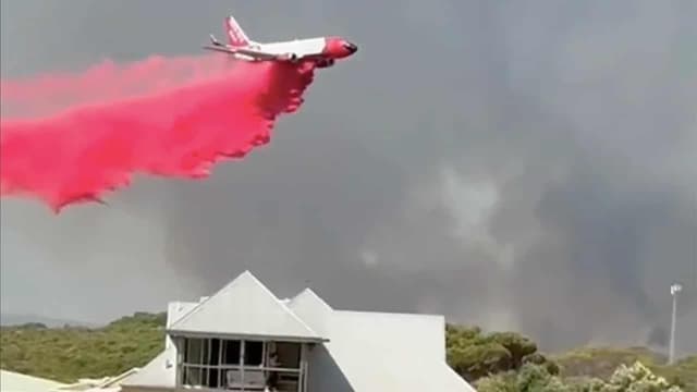 Fire threat eases but residents warned not to return