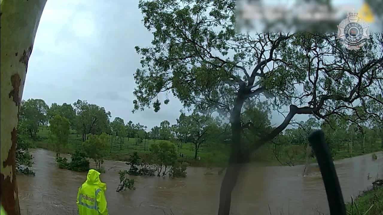Children rescued in floodwaters as showers ease