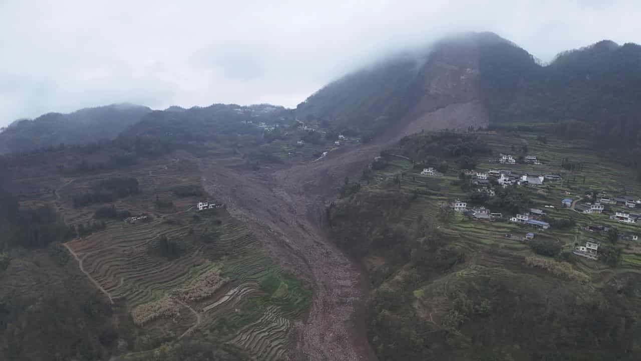 Rescuers search for 30 after a landslide in China