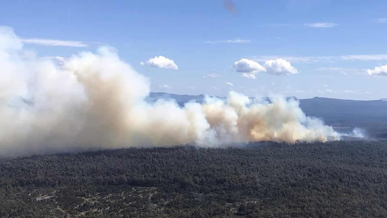 Hot winds heighten risk as bushfires rage, bans issued