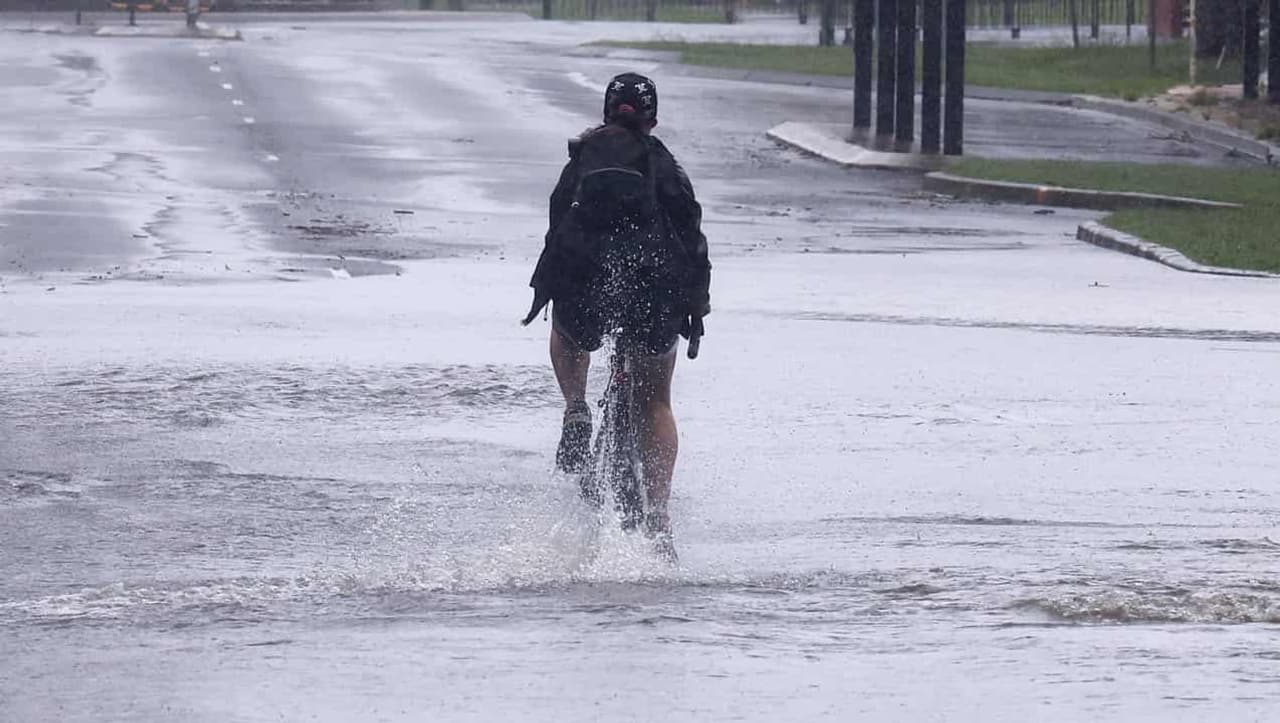 Anxious 'wait and see' as cyclone and floods threaten