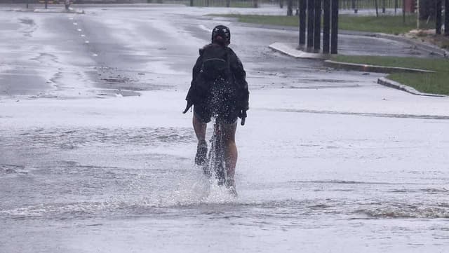 Anxious 'wait and see' as cyclone and floods threaten