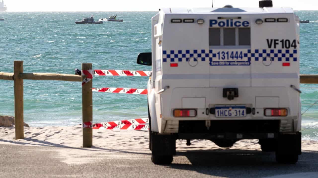 Board found, surfer feared missing after shark sighting