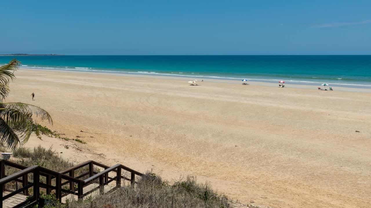 Holidaying surfer presumed dead after shark mauling