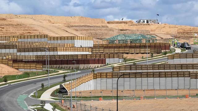 Brick by brick, parties build election housing pitches