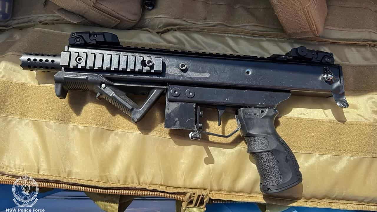 Former cop charged over home-made machine gun cache