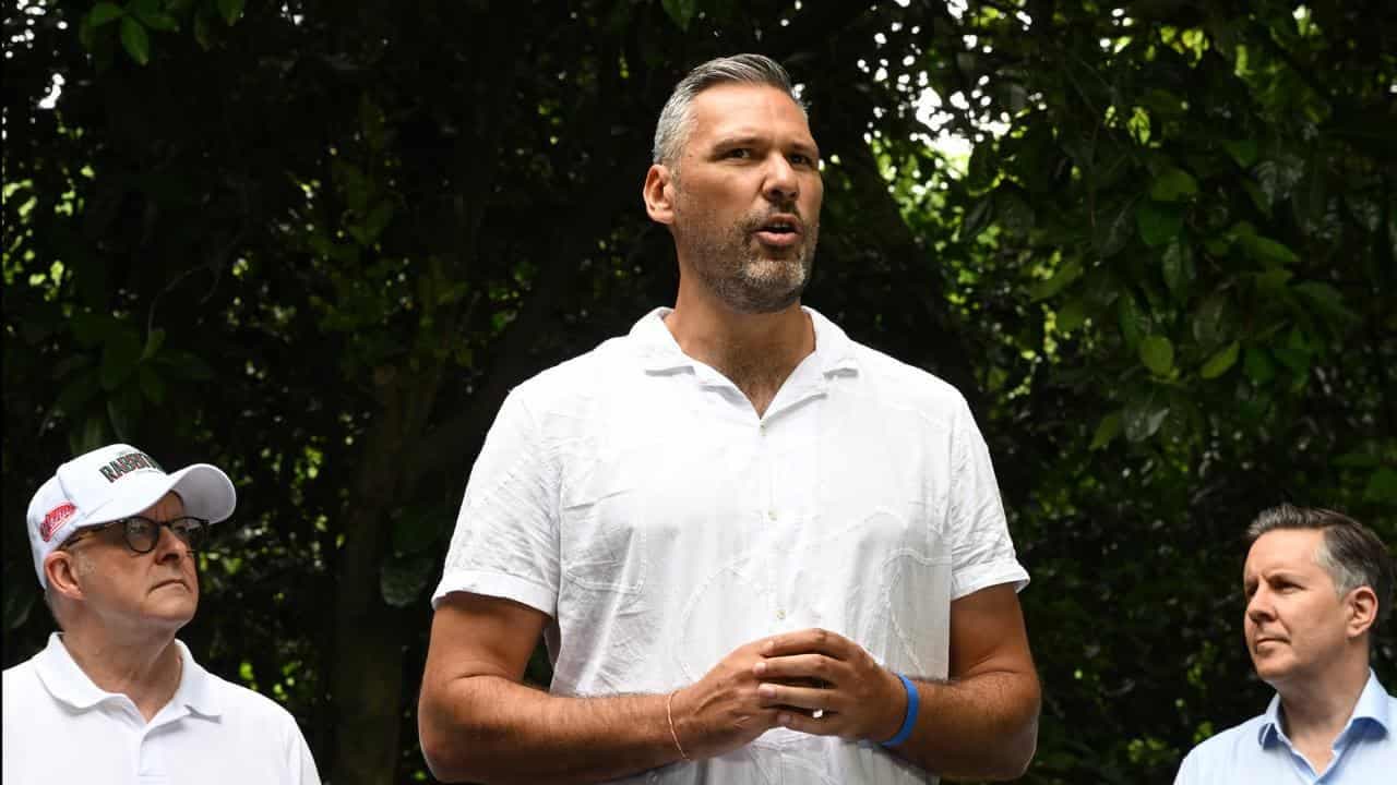 Towering presence, missing minister as PM visits reef