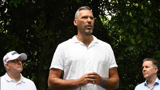 Towering presence, missing minister as PM visits reef