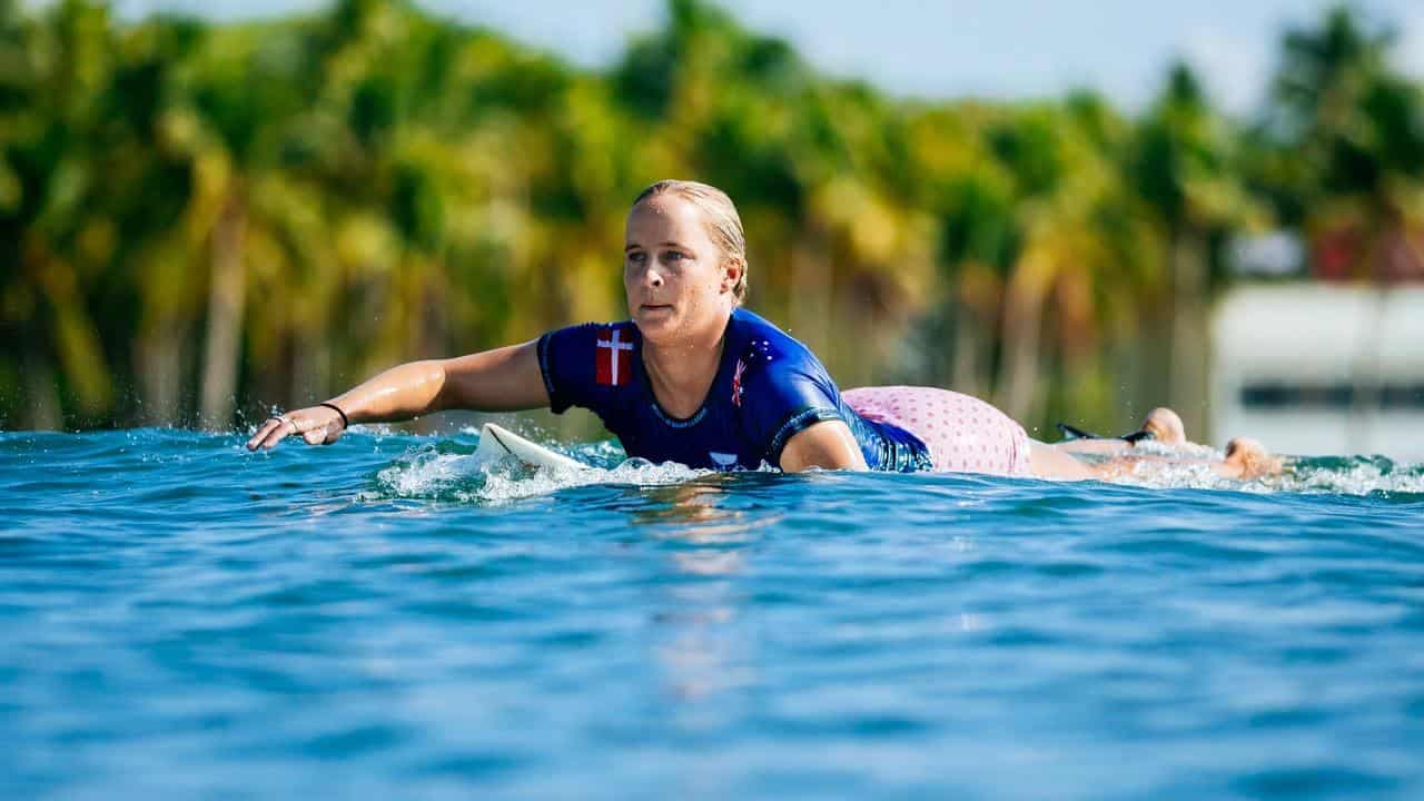 Aussie surfer storms into semi on twin's wedding day