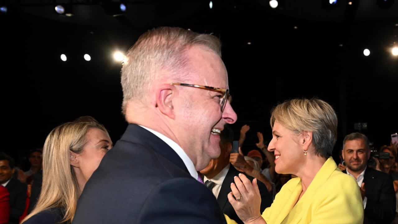 PM downplays awkward air kiss as campaign heads south