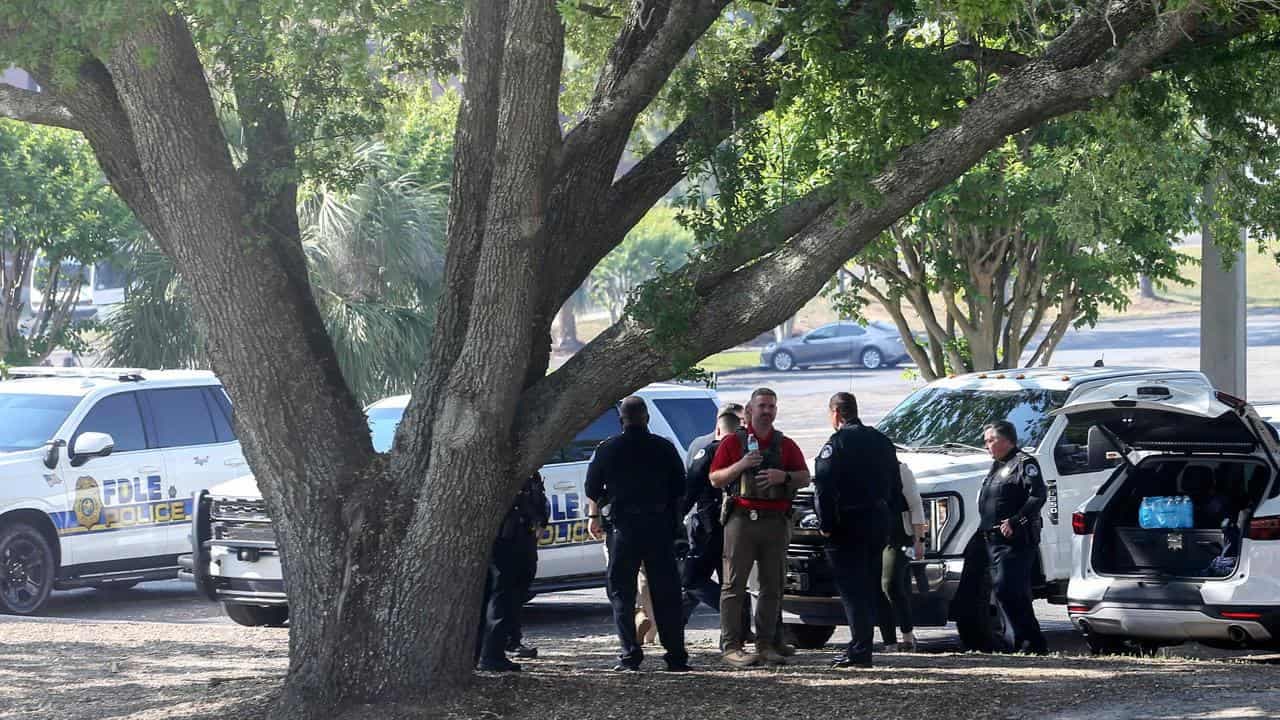Deputy sheriff's son shoots two dead at US university