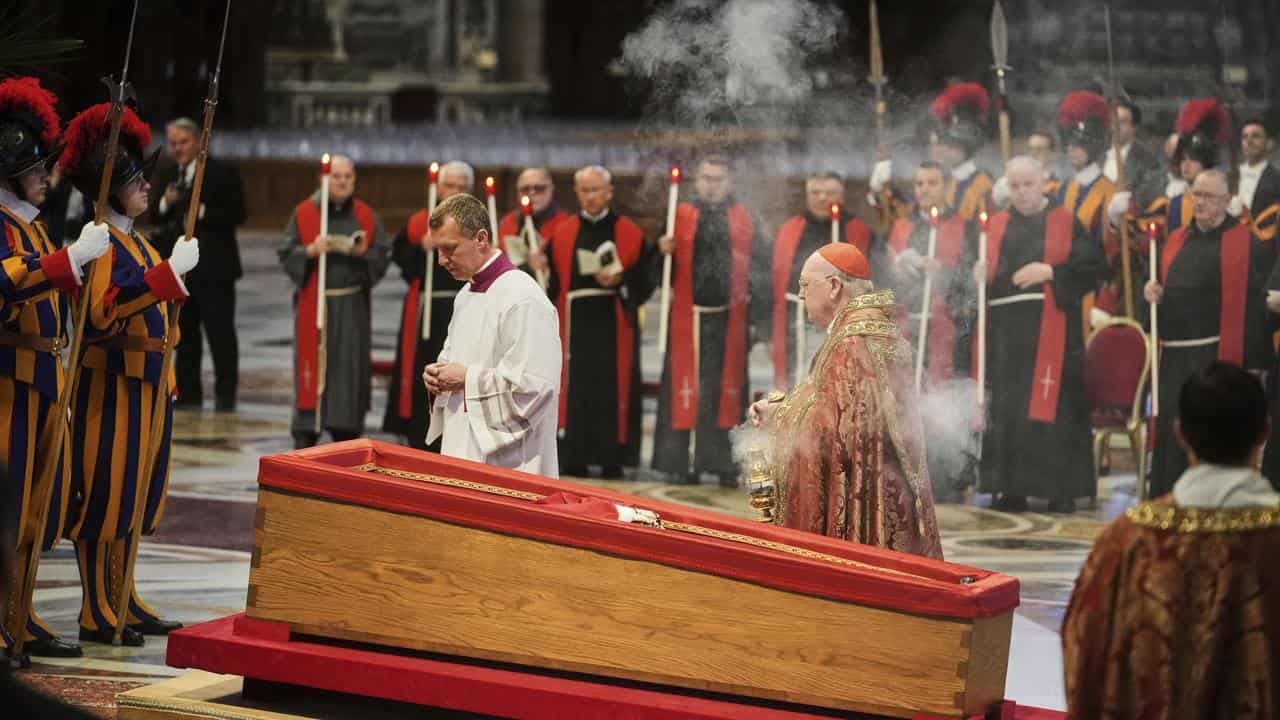 Pope's body placed in basilica after solemn procession