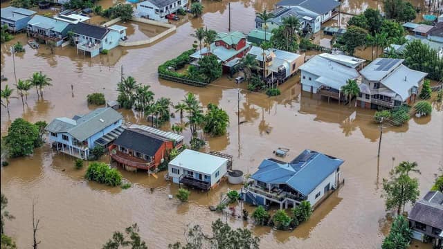 Fifth death linked to floods as body found in burnt car