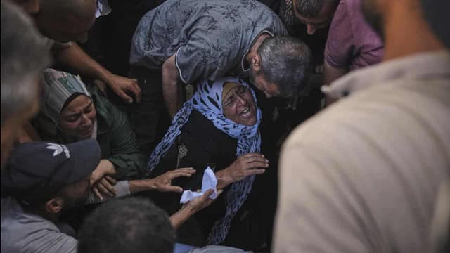 Dozens waiting for aid among 94 killed in Gaza