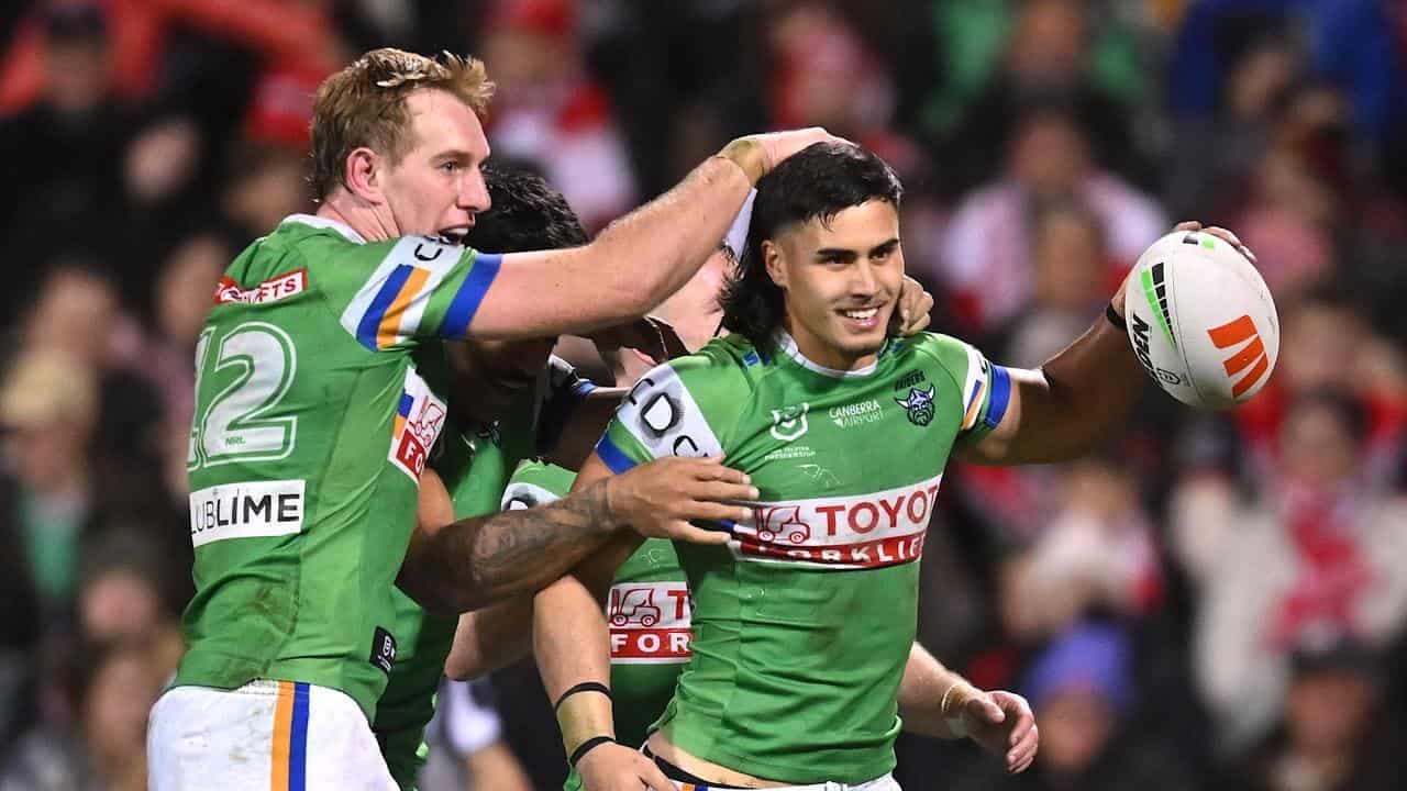 Hat-trick hero helps Raiders pip Dragons, top NRL table