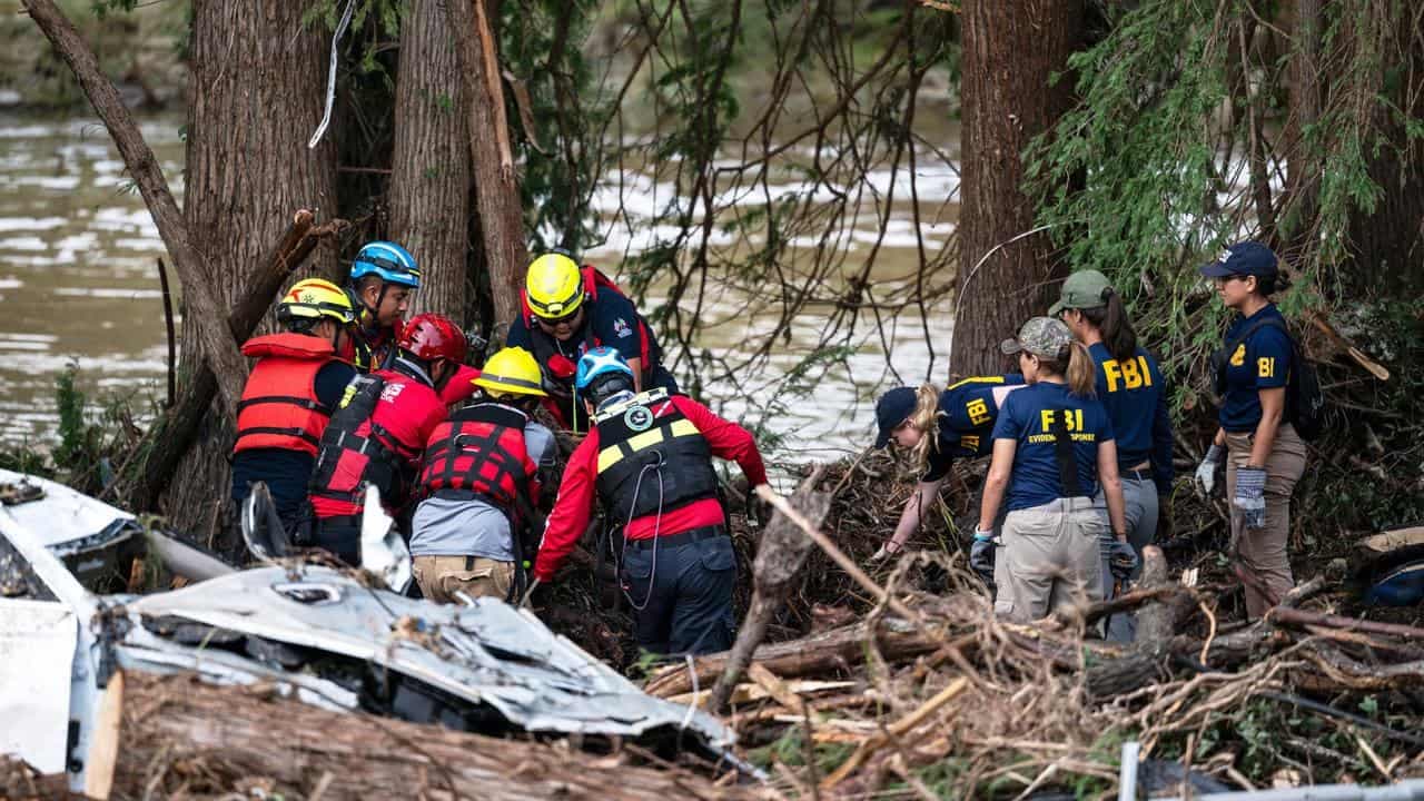 Grim milestone as rescuers search for US flood victims