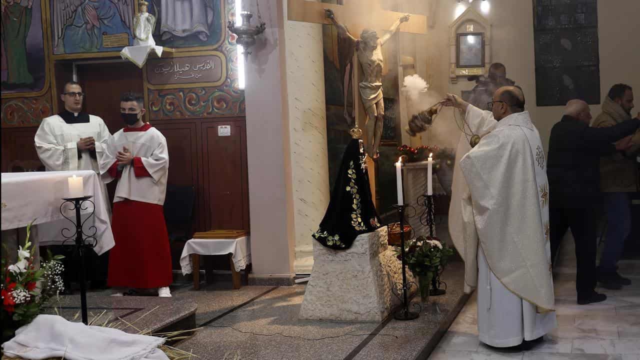 Two die in church as Israeli strikes kill 22 in Gaza