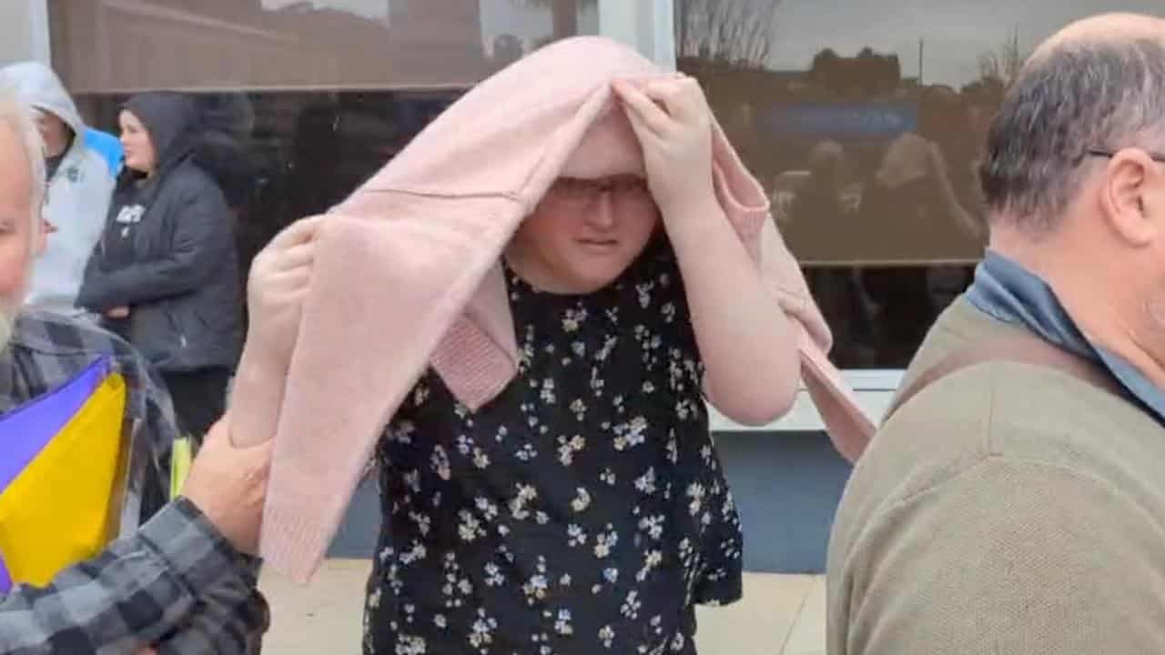 Cloaking tactics: alleged hacker hides face with jumper