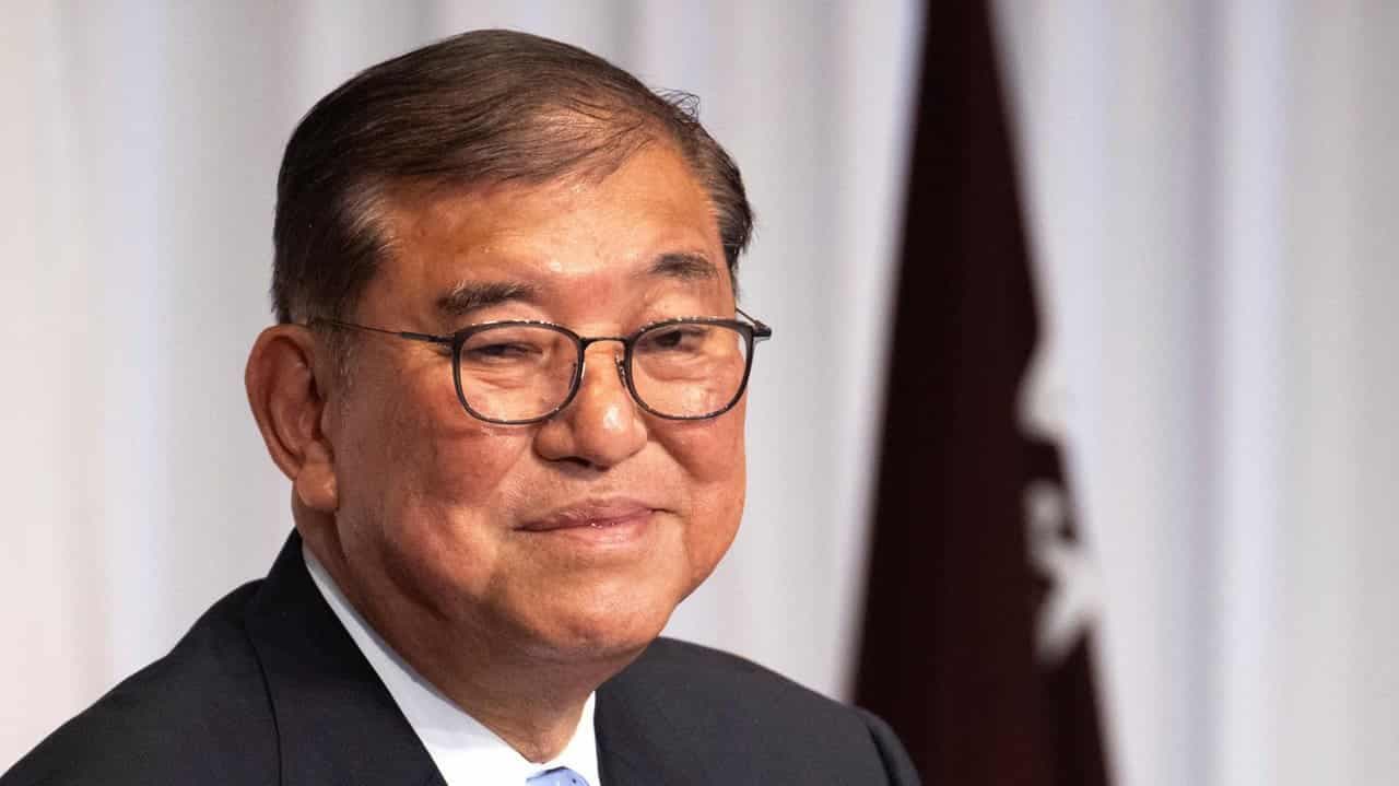 Japan's PM vows to stay on after bruising election loss