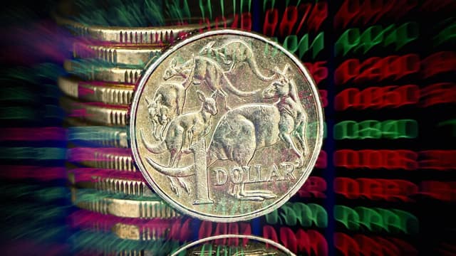 Aussie dollar hits eight-month high as shares slide