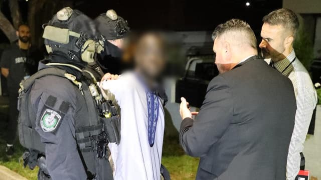 Laughs, dancing as men deny roles in underworld hit