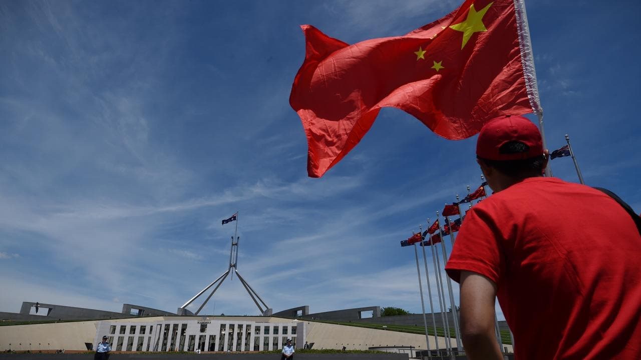 Chinese national charged over 'intelligence gathering'