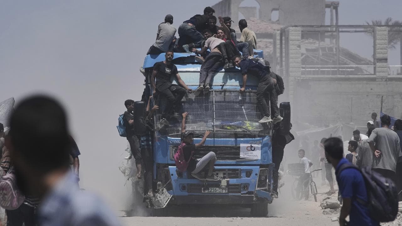 At least 20 killed in Gaza as aid truck overturns