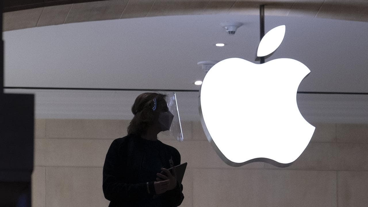 Wall Street ends higher, led by Nasdaq, as Apple jumps